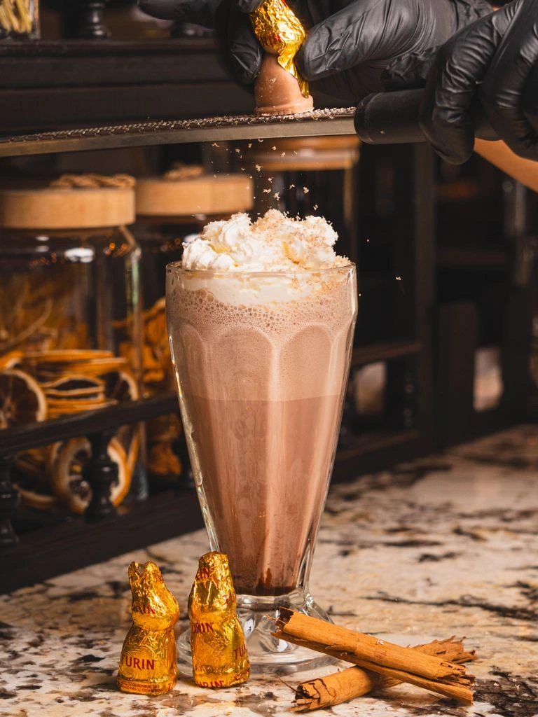 Dark chocolate milkshake with chocolate shavings